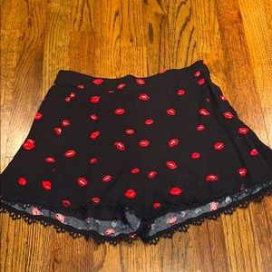 Black shorts with red lips